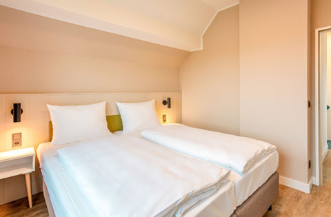 Innenansicht Schlafzimmer Ferienwohnung BEECH Resort Fleesensee